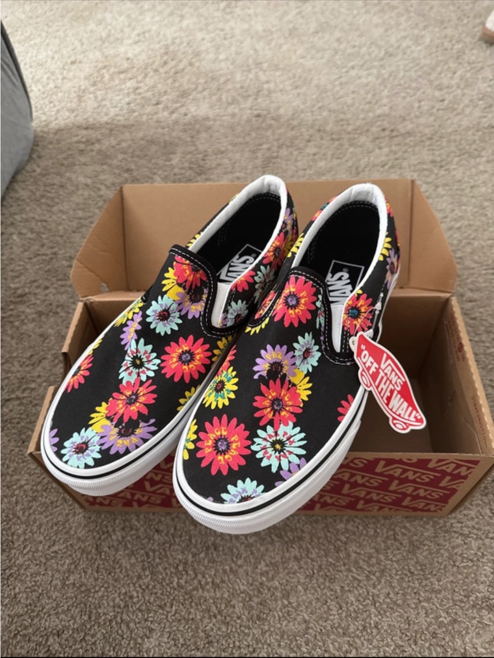 Vans Slip-On Floral Sneakers in Black with Bright Multi Flowers